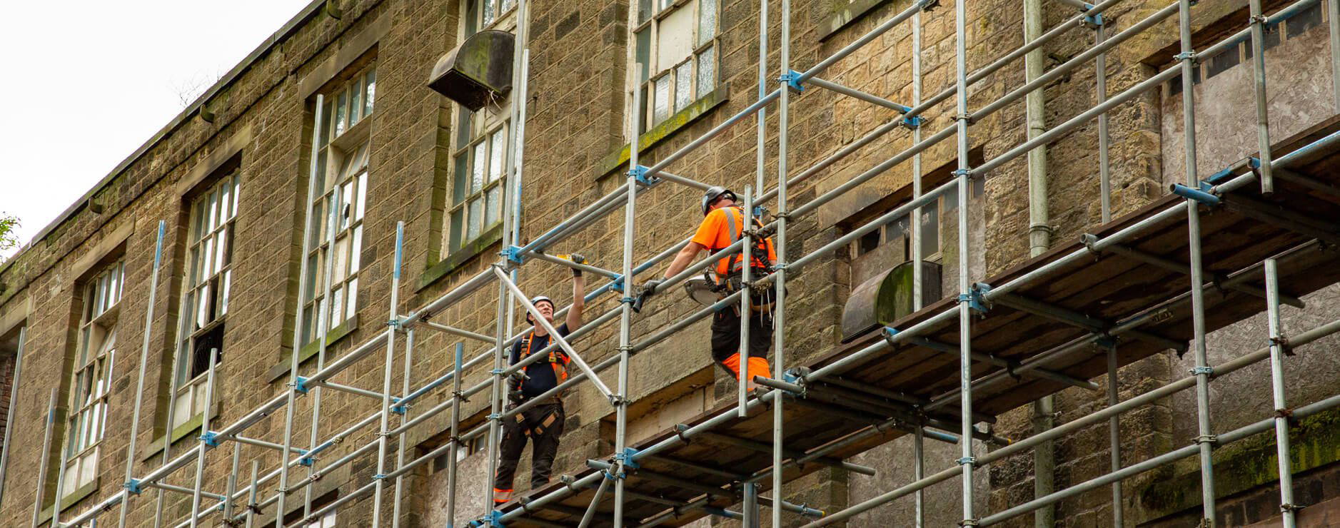 tube and fit scaffold on the elevation of a heritage mill redevelopment in Greater Manchester